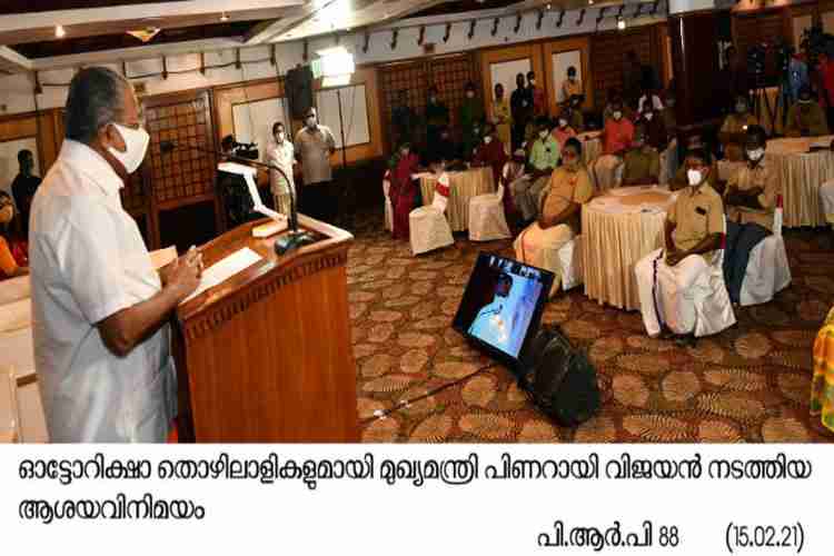 Chief minister Pinarayi Vijayan in conversation with autorikshaw labourers