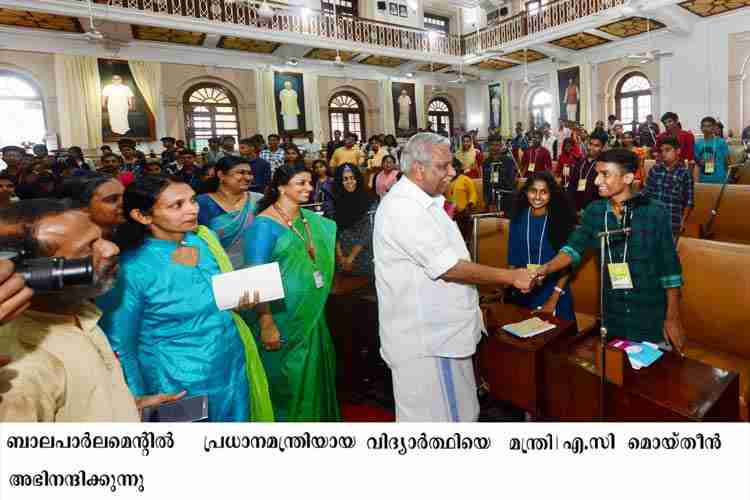 Minister A C Moideen congratulating Prime minister of Bala Parliament